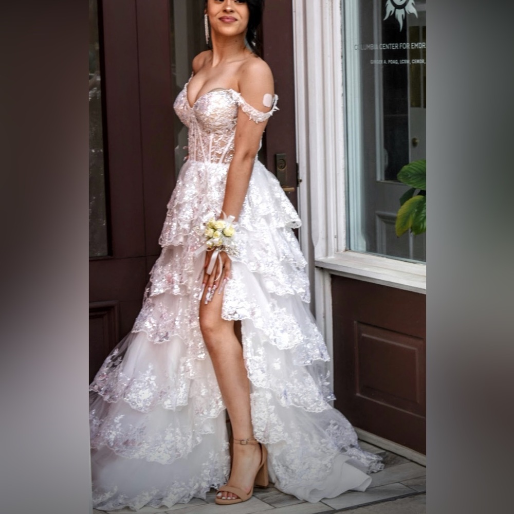 This is a Sherri hill dress, size 4, and a white/silver beautiful dress